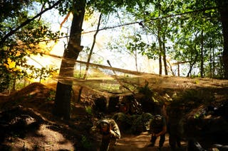 Ukrainian servicemen fire a self-propelled Howitzer towards Russian troops in a front line in Kharkiv region